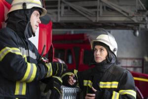 male female firefighters working together suits helmets scaled 1